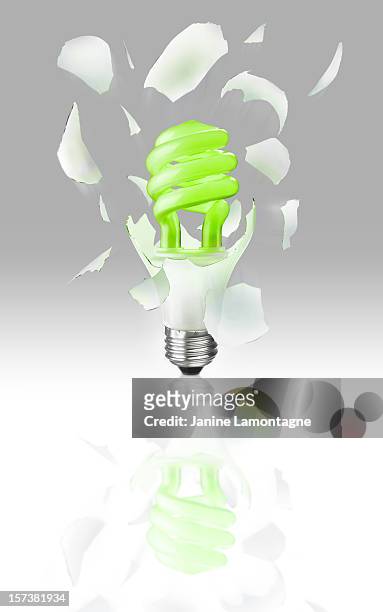 exploding light bulb on gray - broken lamp stock pictures, royalty-free photos & images