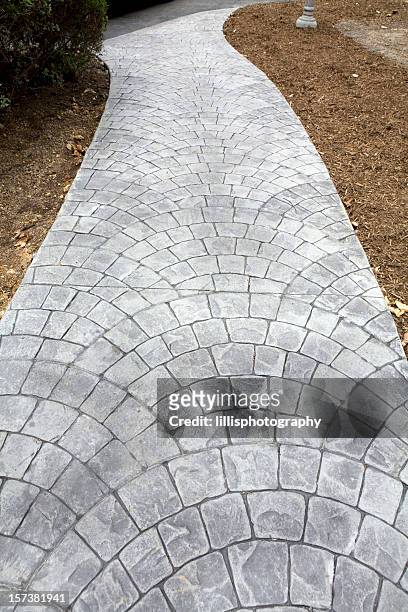 stamped concrete sidewalk - stamped concrete stockfoto's en -beelden