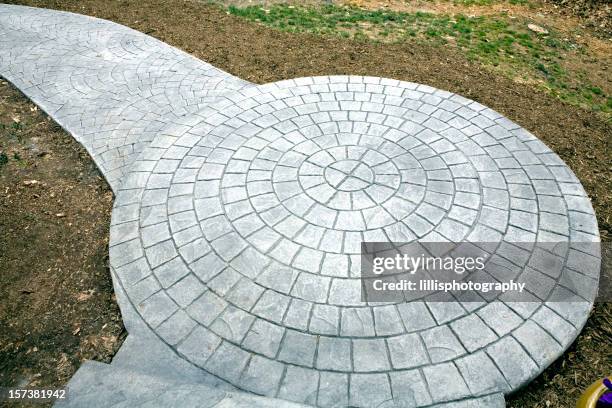 stamped concrete sidewalk - stamped concrete stockfoto's en -beelden