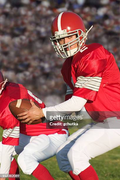 football play - quarterback stock pictures, royalty-free photos & images