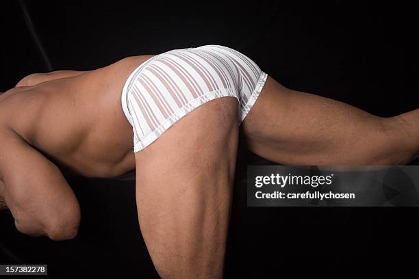 butt and thigh of muscular male - male buttocks stockfoto's en -beelden