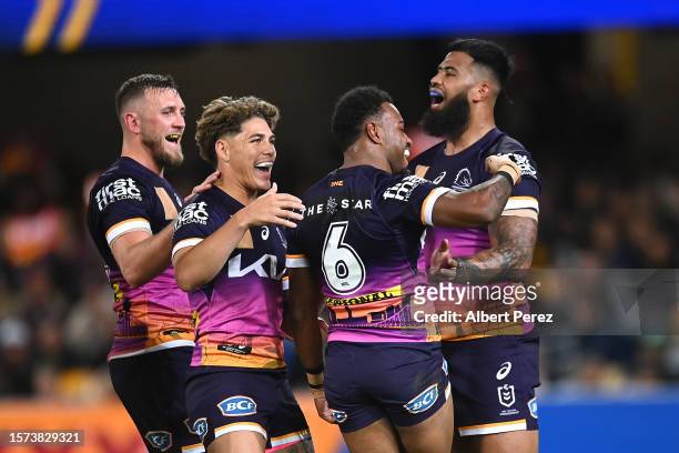 Ezra Mam of the Broncos celebrates with team mates after scoring a try during the round 22 NRL match between Brisbane Broncos and Sydney Roosters at...