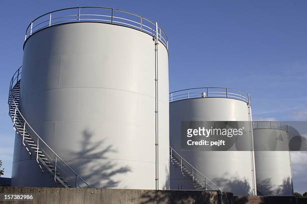 white oil tanks for storing fuel appear to be blank canvases - silos stock pictures, royalty-free photos & images