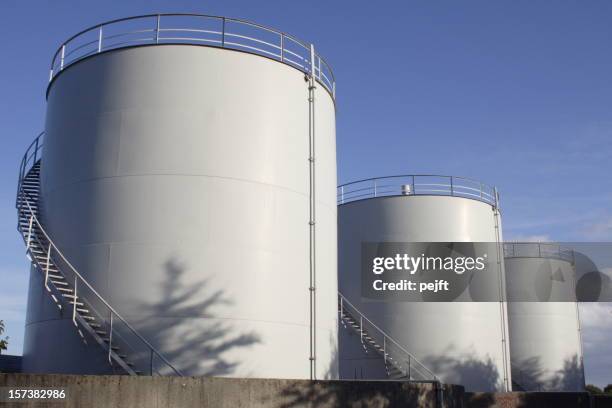 white oil tanks for storing fuel appear to be blank canvases - bränsletank bildbanksfoton och bilder