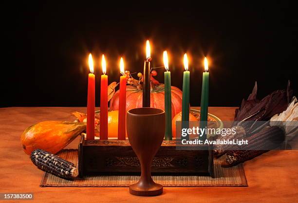 kwanzaa table candles glowing - kwanzaa stock pictures, royalty-free photos & images