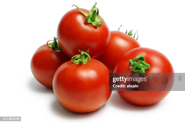 a pile of ripe red tomatoes on a white background - tomato isolated stock pictures, royalty-free photos & images