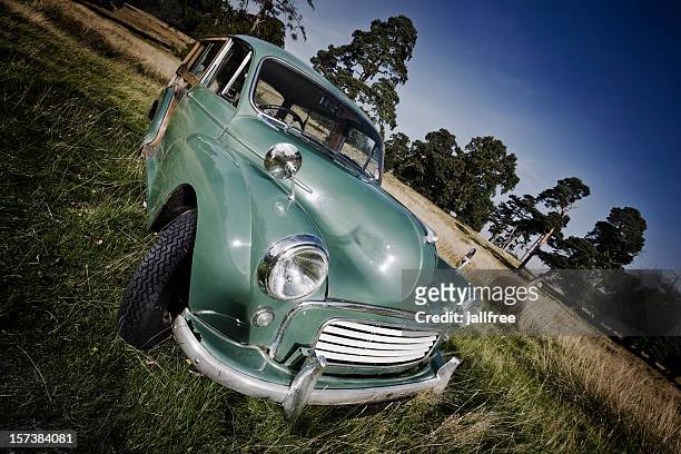 1960 old classic car morris traveller in field - morris traveller stock pictures, royalty-free photos & images