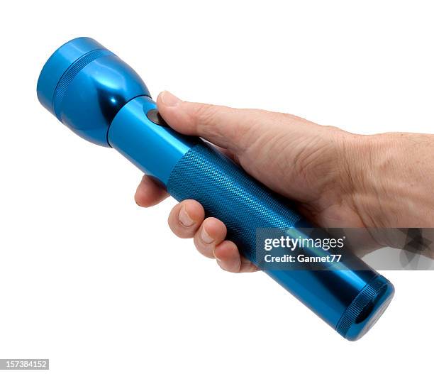 hand with blue flashlight - electric torch stock pictures, royalty-free photos & images