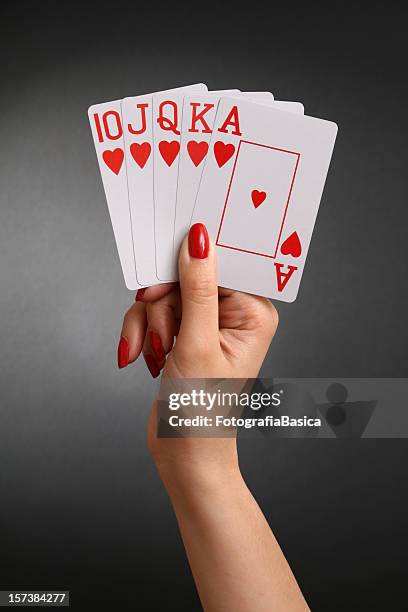 holding royal flush - hand of cards stock pictures, royalty-free photos & images