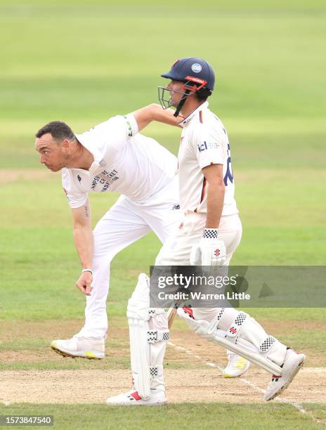 Kyle Abbott of Hampshire bowls watched by Alastair Cook of Essex during the LV= Insurance County Championship Division 1 match between Hampshire and...