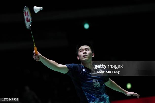 Kunlavut Vitidsarn of Thailand competes in the Men's Singles Second Round match against Kenta Nishimoto of Japan on day three of the Japan Open at...