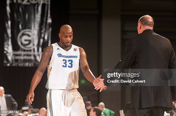 Darnell Jackson of the Reno Bighorns greets head coach Paul Mokeski after coming out of the game in the first quarter against the Santa Cruz Warriors...