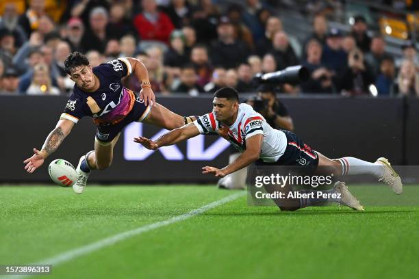 Kotoni Staggs of the Broncos attempts to score a try during the round 22 NRL match between Brisbane Broncos and Sydney Roosters at The Gabba on July...