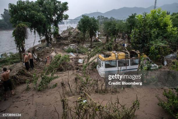 Vehicle stranded in mud following Typhoon Doksuri in the Mentougou district of Beijing, China, on Thursday, Aug. 3, 2023. The deluge of rain that...