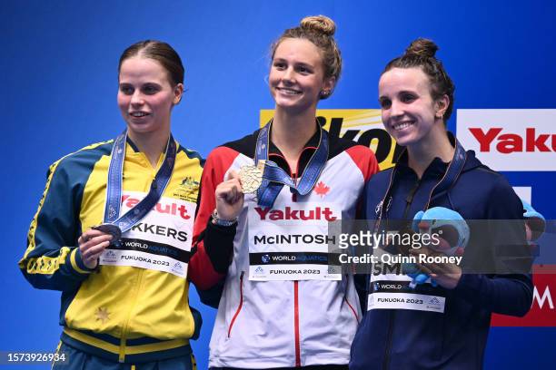 Silver medallist Elizabeth Dekkers of Team Australia, gold medallist Summer Mcintosh of Team Canada and Regan Smith of Team United States pose during...
