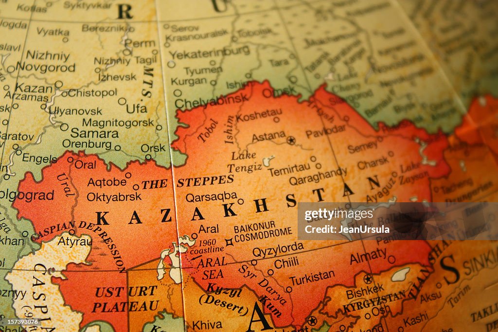 An earth tone political map focused on Kazakhstan