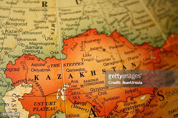 an earth tone political map focused on kazakhstan - kazakhstan stock pictures, royalty-free photos & images