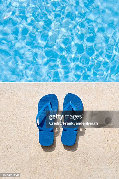 flip flops next to pool - thong stock pictures, royalty-free photos & images