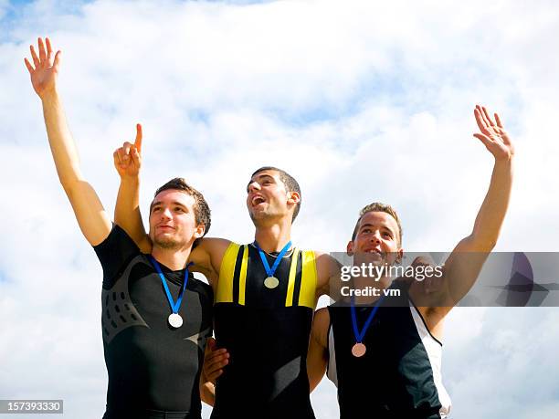 winners on podium - bronze medal stock pictures, royalty-free photos & images
