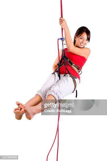 rapelling climber - abseilen stockfoto's en -beelden