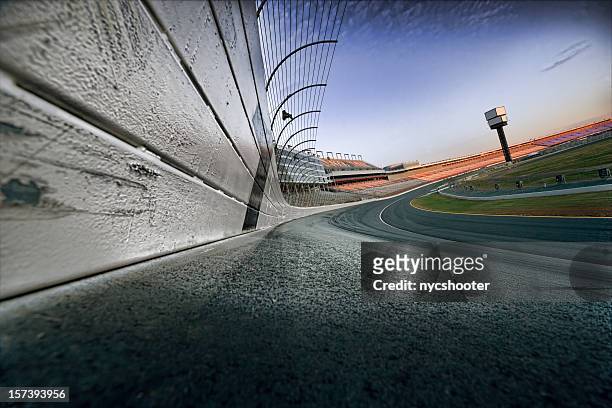 race track at dawn - racing stockfoto's en -beelden