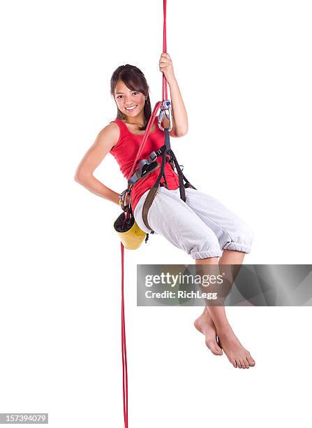 teenager felsklettern - woman climbing rope stock-fotos und bilder