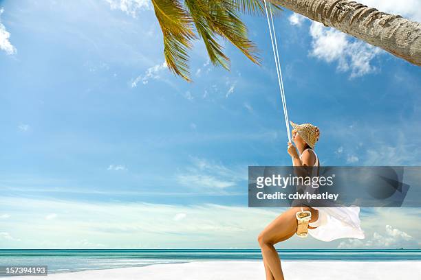 woman on a swing - sarong stock pictures, royalty-free photos & images