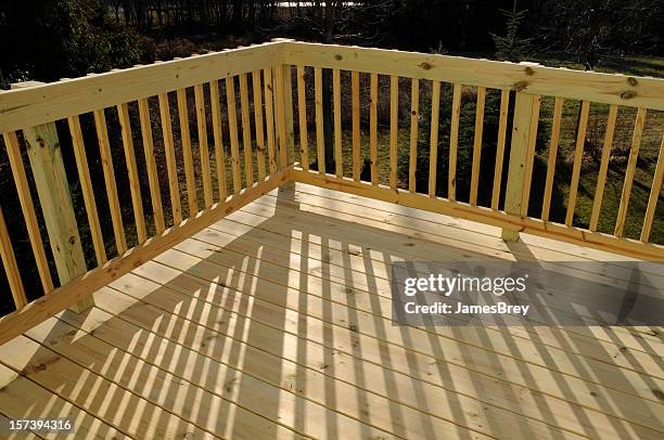 new pine wood stock lumber patio deck building, railing, shadow - new deck stock pictures, royalty-free photos & images