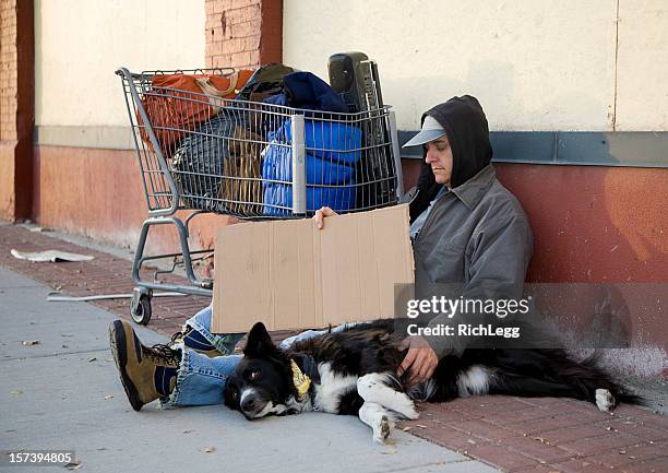 homeless man on a city street - man sleeping with cap stock pictures, royalty-free photos & images
