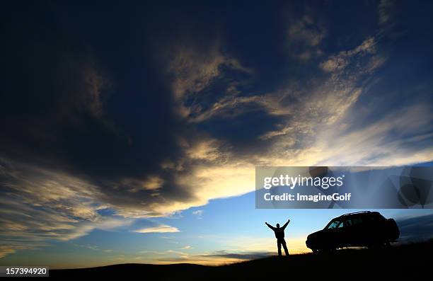 happy traveller beside his suv vehicle - car mountain stock pictures, royalty-free photos & images