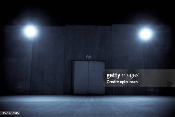 night shadows - factory door stock pictures, royalty-free photos & images