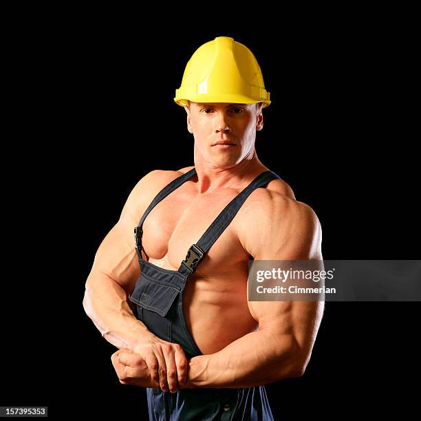 muscular construction worker - human muscle stockfoto's en -beelden