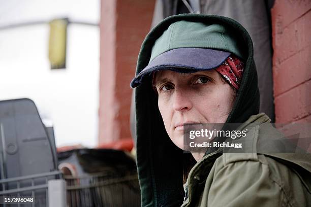 homeless woman on a city street - homelessness stockfoto's en -beelden