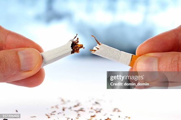 quit smoking, cigarette broken in half, isolated white, x-ray background - quit smoking stockfoto's en -beelden