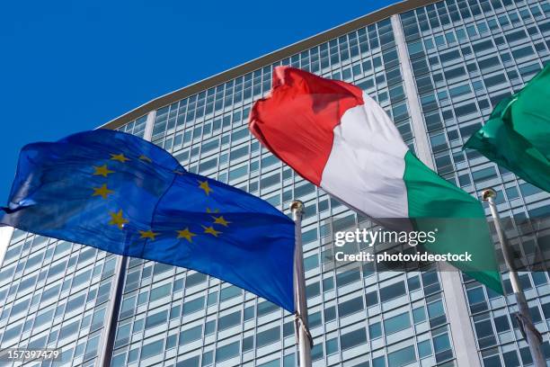 pirellone skyscraper in milan with italian and european flags - all european flags stock pictures, royalty-free photos & images