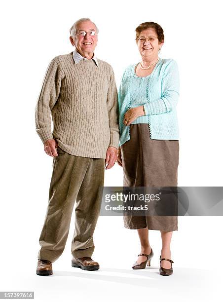 smiling senior couple standing next to each other - well dressed couple isolated stock pictures, royalty-free photos & images