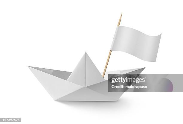 paper boat with flag - white flag stockfoto's en -beelden