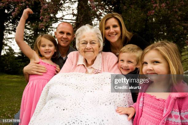 great grandmother and extended family children adults offspring outdoors - 101 stockfoto's en -beelden