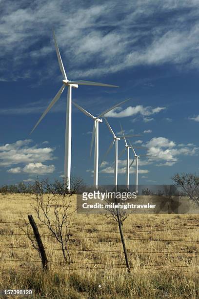 wind ranch turbines on dry texas grasslands - amarillo color stockfoto's en -beelden