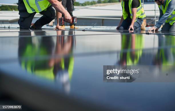 commercial solar panel install - solar powered station stock pictures, royalty-free photos & images