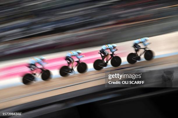 Belgium take part in a men's Elite Team Pursuit qualification race at the Sir Chris Hoy velodrome during the UCI Cycling World Championships in...