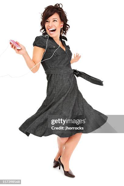 jeune femme danse heureux - women dancing on music cutout photos et images de collection