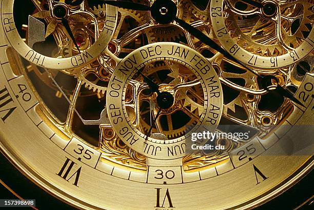 clockwork orange gold - horloge stockfoto's en -beelden