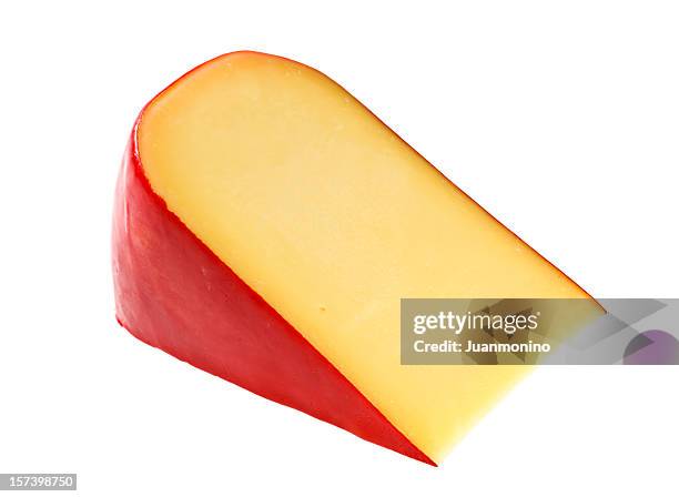 piece of dutch gouda cheese - gouda stockfoto's en -beelden