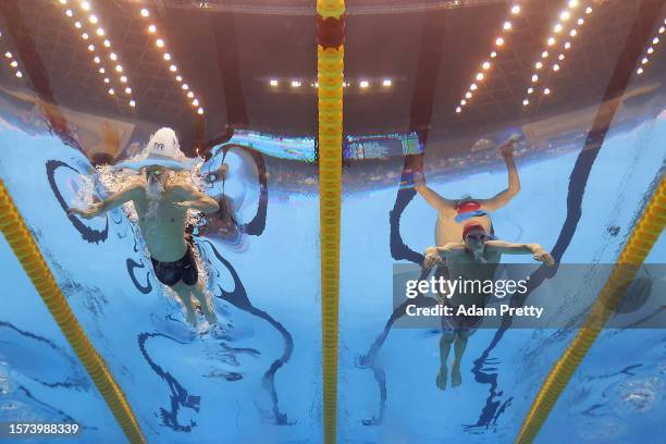 Leon Marchand of Team France and Duncan Scott of Team Great Britain compete in the Men's 200m Individual Medley Final on day five of the Fukuoka 2023...