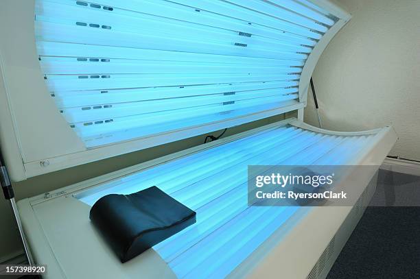 tanning bed open and on. - tanning bed stock pictures, royalty-free photos & images