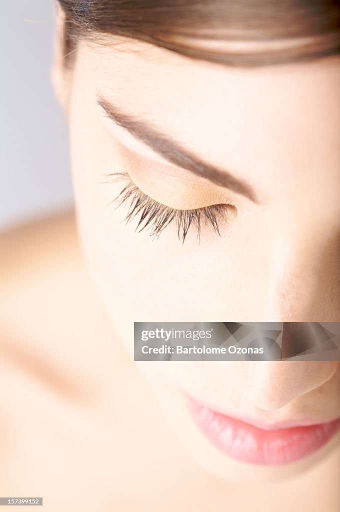 Soft portrait of beautiful young woman with closed eyes