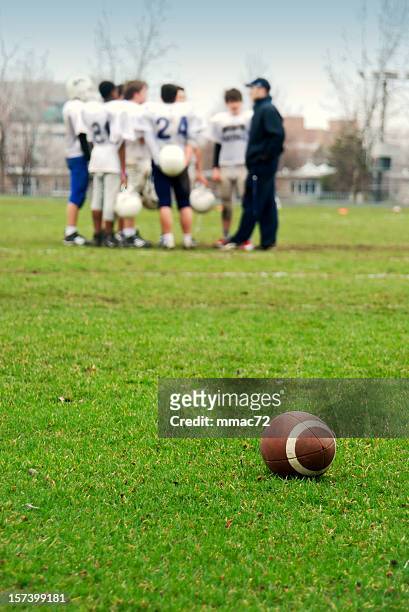 football team and coach - american football coach stock pictures, royalty-free photos & images