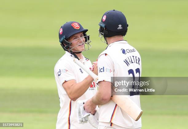 Michael Pepper and Paul Walter of Essex celebrate winning the LV= Insurance County Championship Division 1 match between Hampshire and Essex at Ageas...