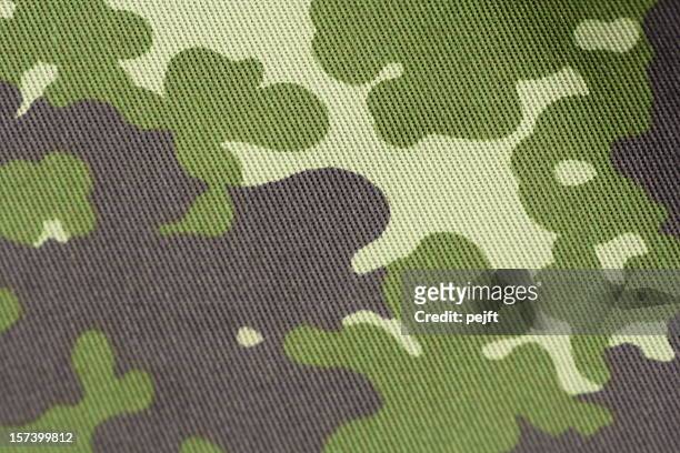 camouflage - military uniform cloth in nato pattern full frame - camouflagekleding stockfoto's en -beelden